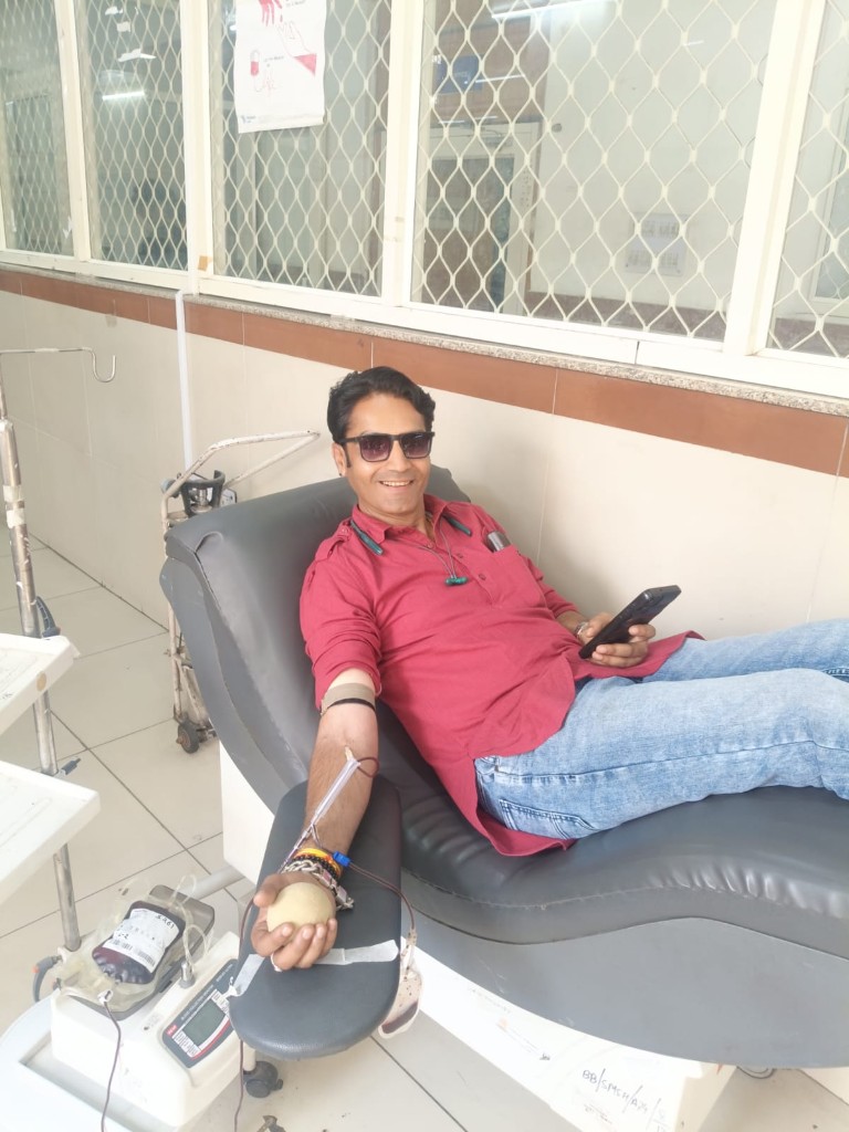 Donor smiling while giving blood