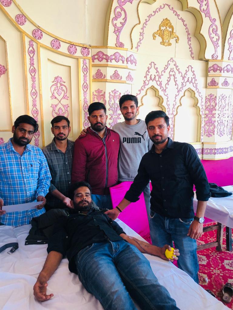 Team with donor at donation camp